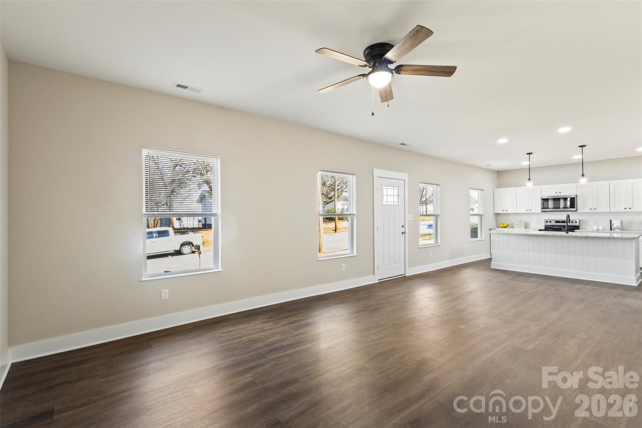 316 Union Street Maiden, NC 28650 - Photo 5 of 23 a view of an empty room with window and wooden floor