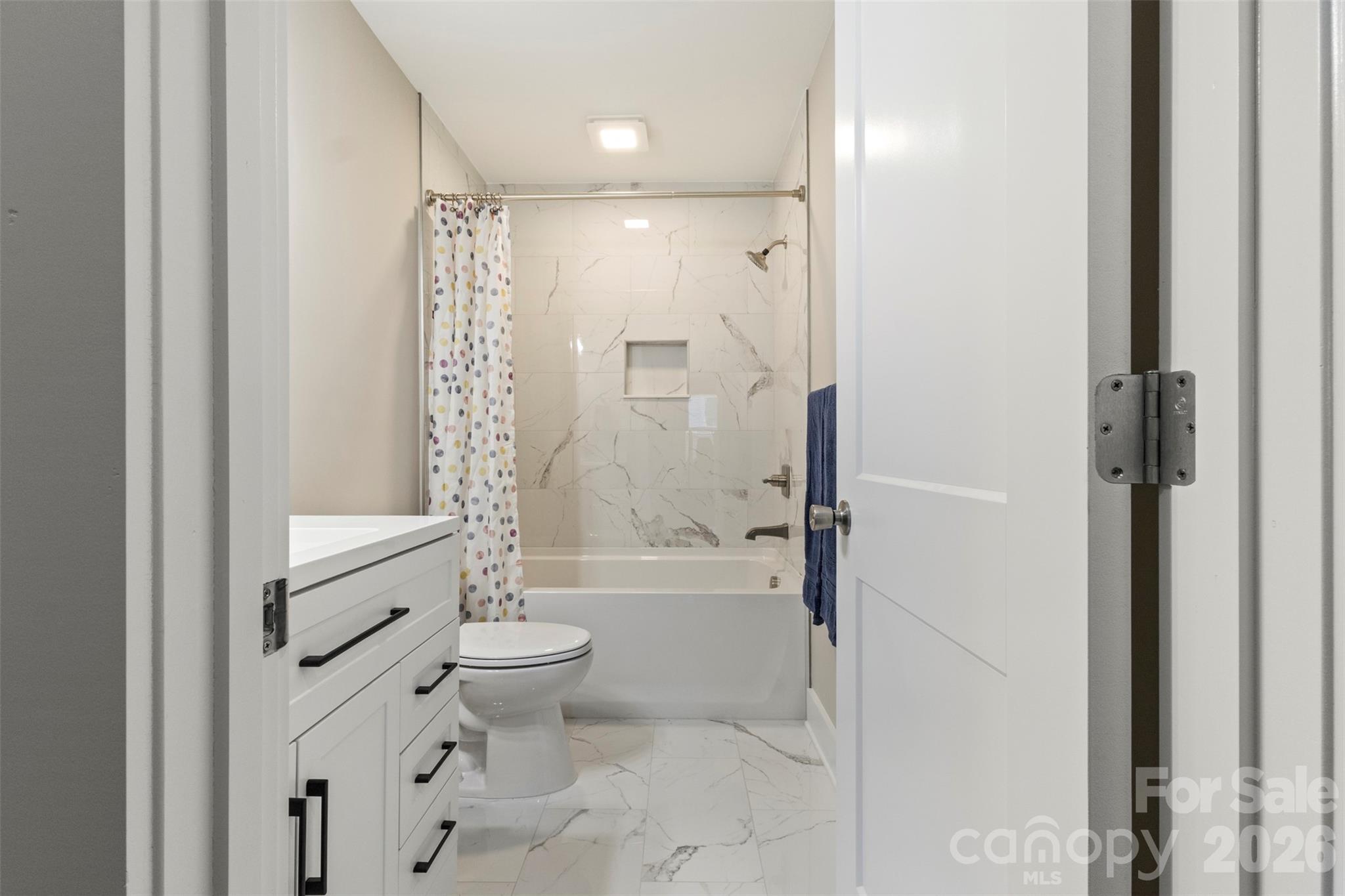 316 Union Street Maiden, NC 28650 - Photo 9 of 21 a bathroom with a bathtub toilet and shower