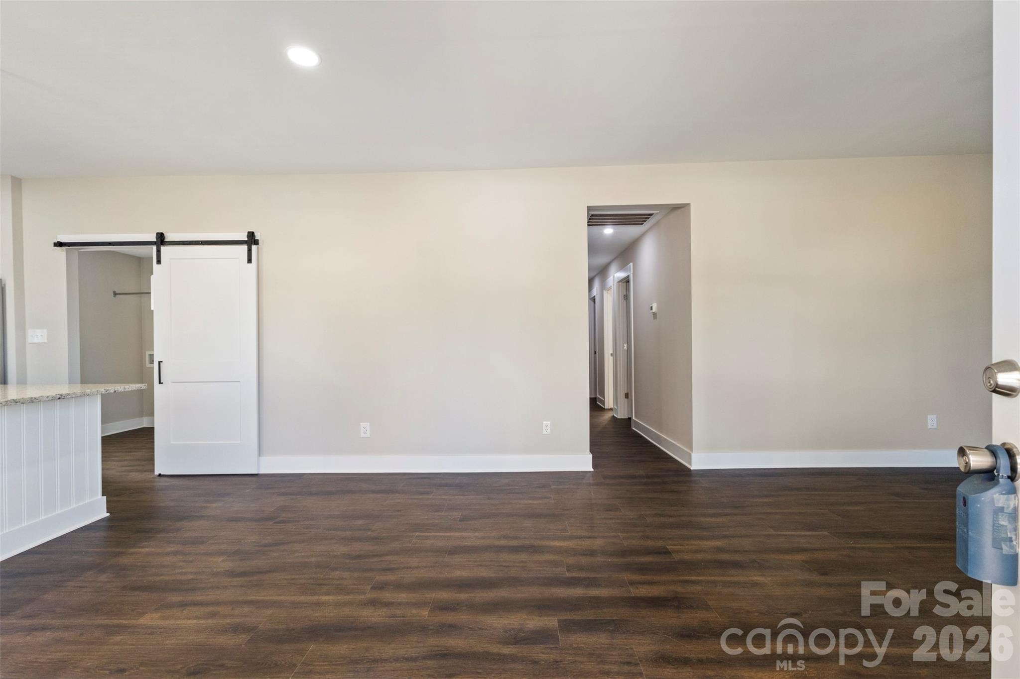 316 Union Street Maiden, NC 28650 - Photo 9 of 23 a view of an empty room with wooden floor and closet