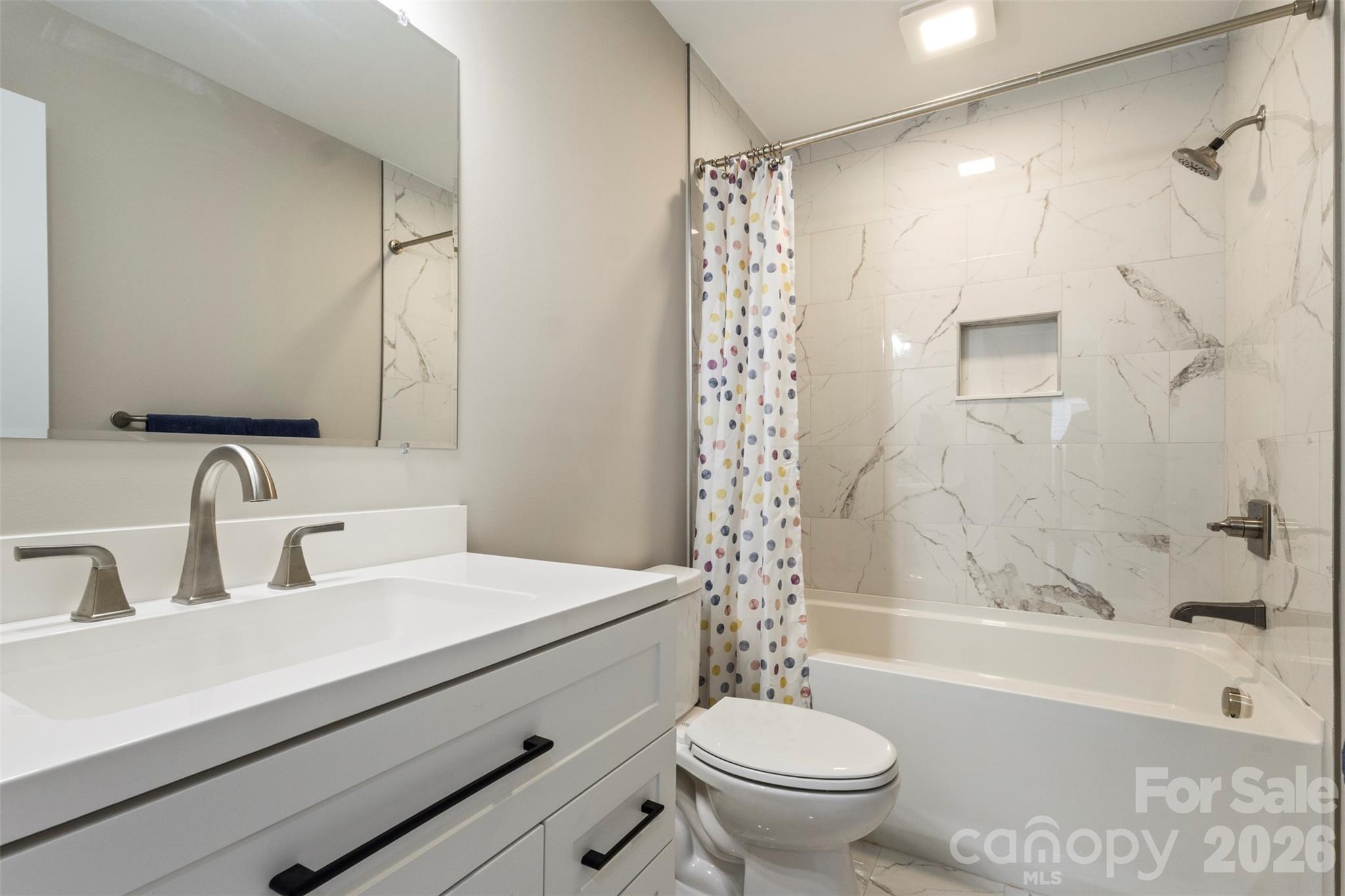 316 Union Street Maiden, NC 28650 - Photo 10 of 21 a bathroom with a sink a toilet and a bathtub