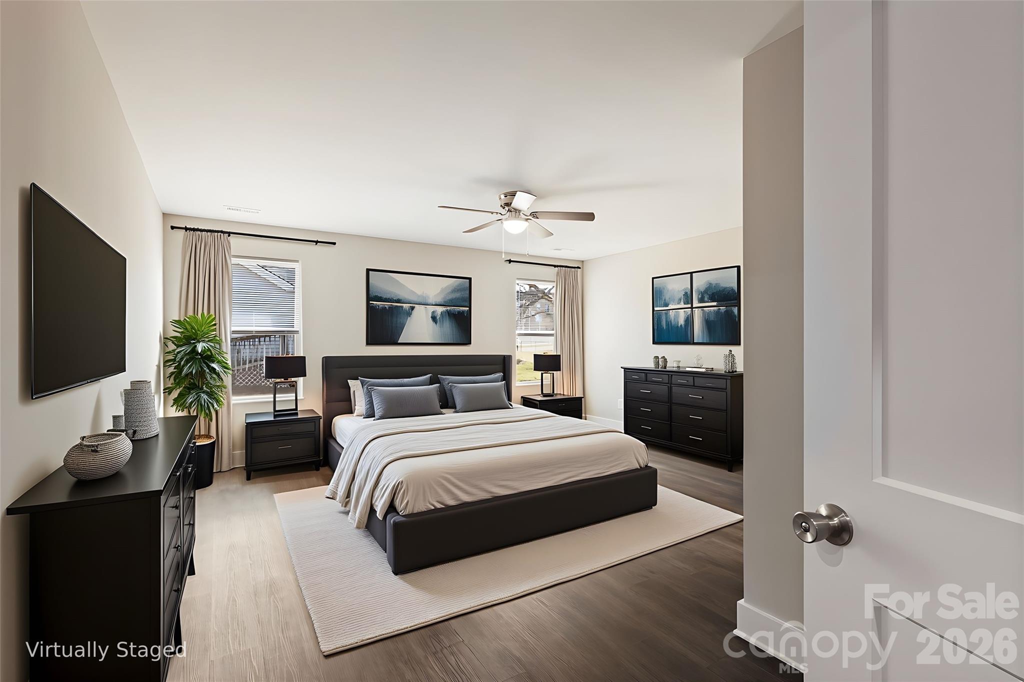 316 Union Street Maiden, NC 28650 - Photo 10 of 23 a bedroom with a bed a mirror and a flat screen tv