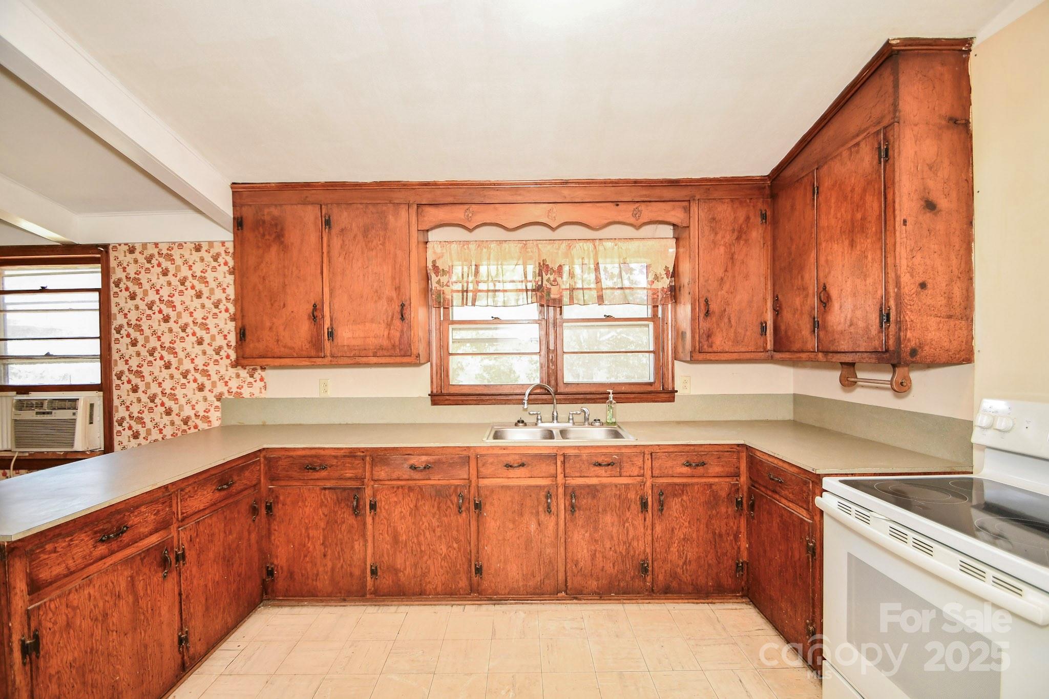 2922 Joe Griffin Road Monroe, NC 28112 - Photo 20 of 26 a kitchen with a sink and a window