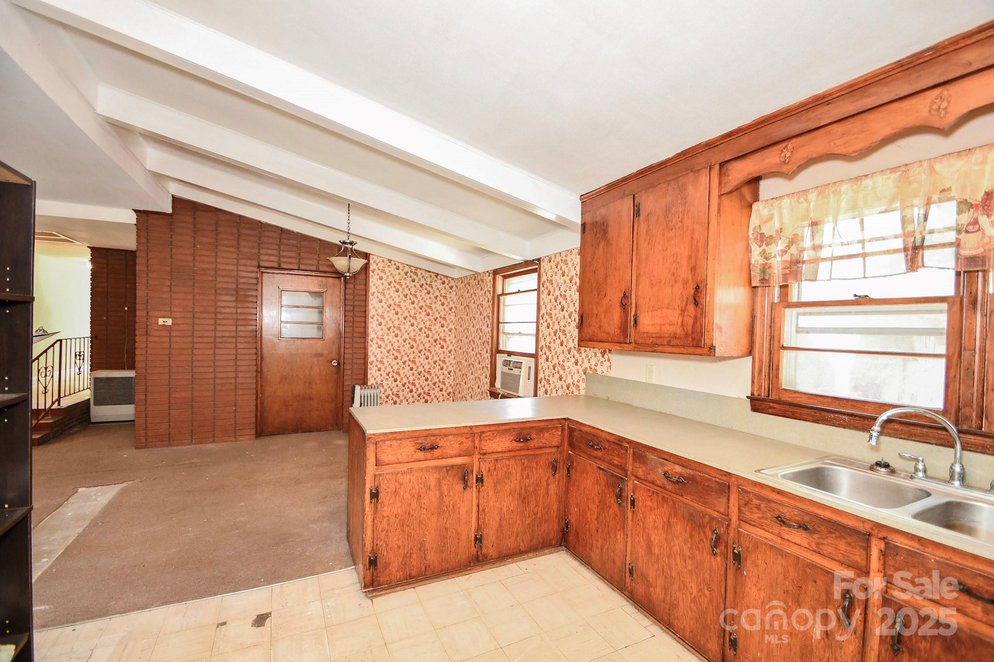 2922 Joe Griffin Road Monroe, NC 28112 - Photo 21 of 26 a large white kitchen with a large window