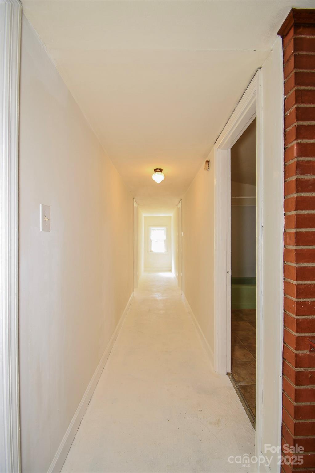2922 Joe Griffin Road Monroe, NC 28112 - Photo 22 of 26 a view of a hallway with wooden shelves