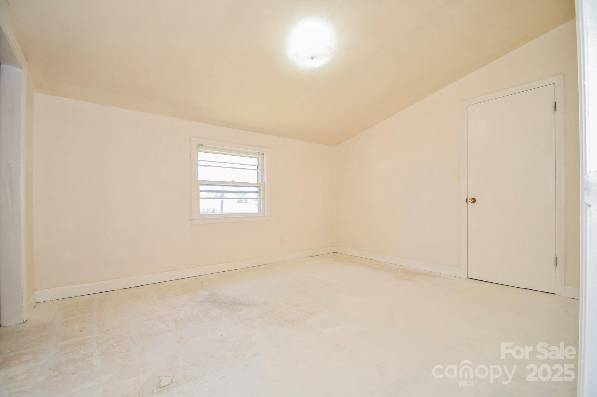 2922 Joe Griffin Road Monroe, NC 28112 - Photo 23 of 26 an empty room with windows