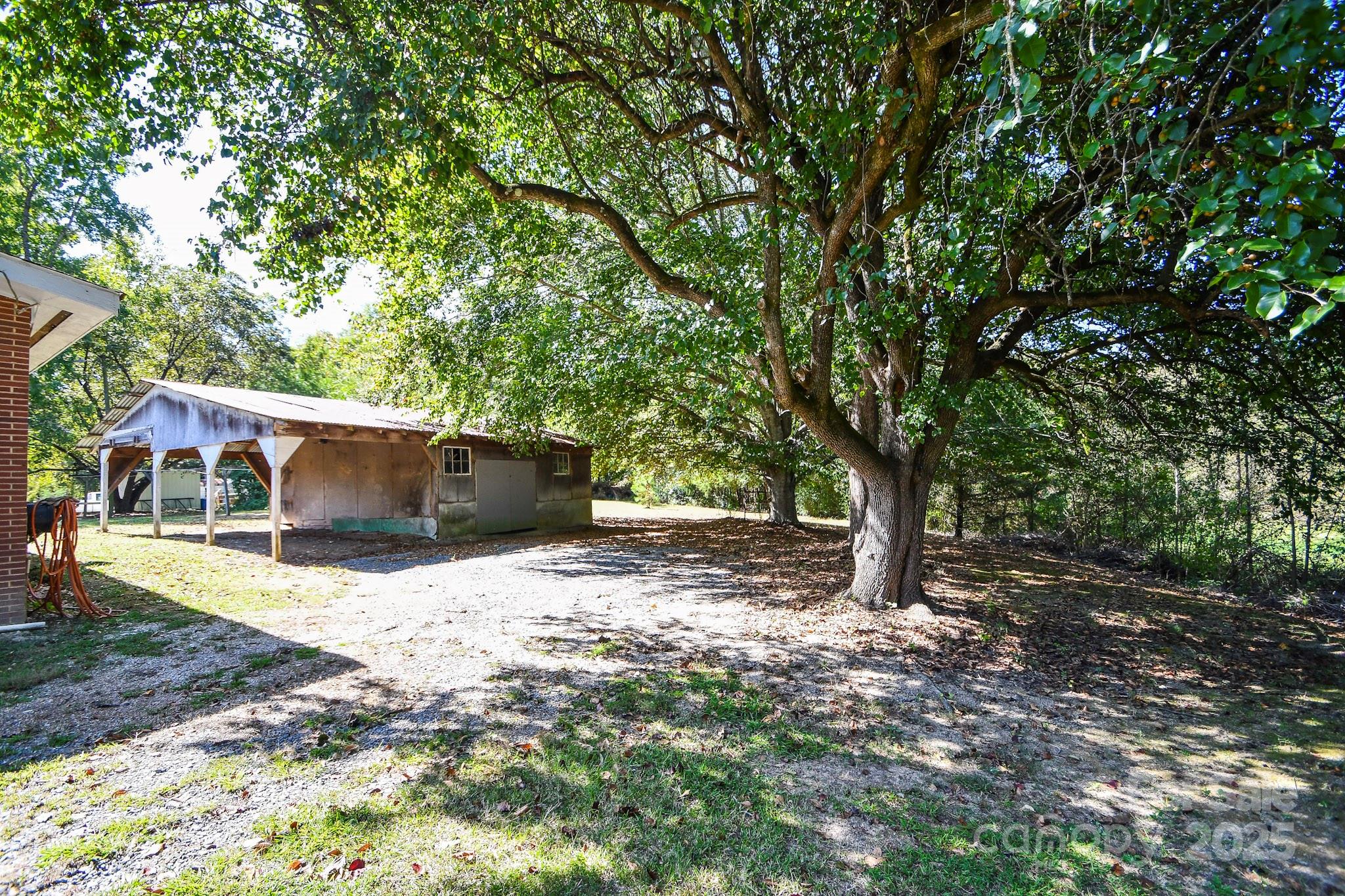 2922 Joe Griffin Road Monroe, NC 28112 - Photo 3 of 26 a backyard of a house with oven and tree