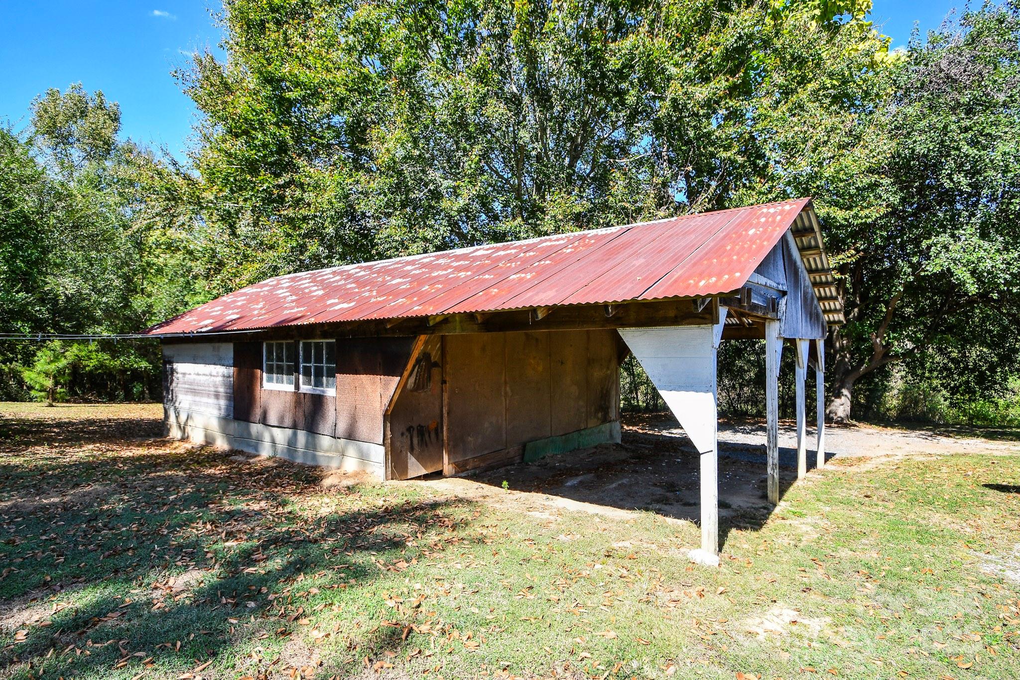 2922 Joe Griffin Road Monroe, NC 28112 - Photo 4 of 26 a front view of a house with a yard and garage