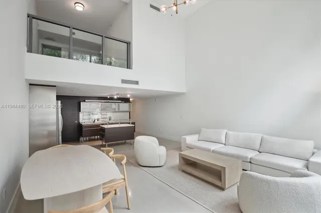 a living room with furniture and window