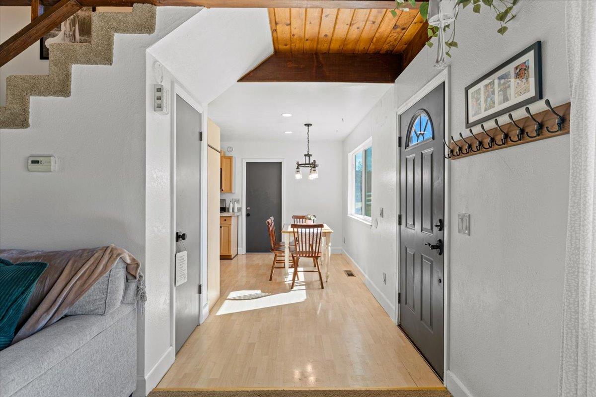 10402 Newtown Road Nevada City, CA 95959 - Photo 11 of 44 a view of a hallway with a dining area