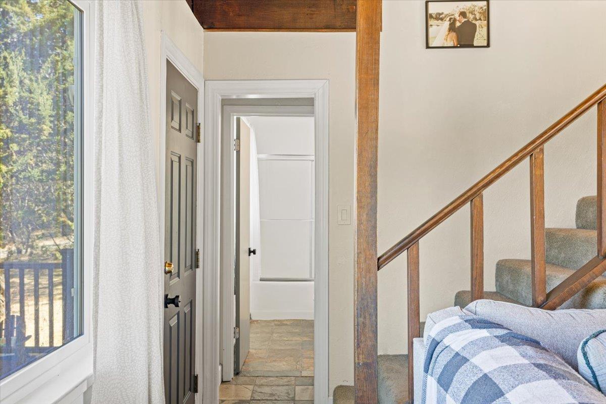 10402 Newtown Road Nevada City, CA 95959 - Photo 14 of 44 a view of a bedroom with furniture and windows