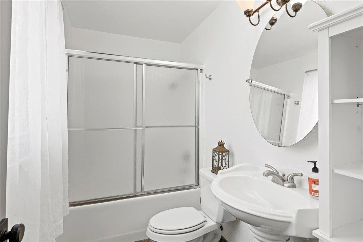 10402 Newtown Road Nevada City, CA 95959 - Photo 15 of 44 a bathroom with a sink vanity mirror and toilet