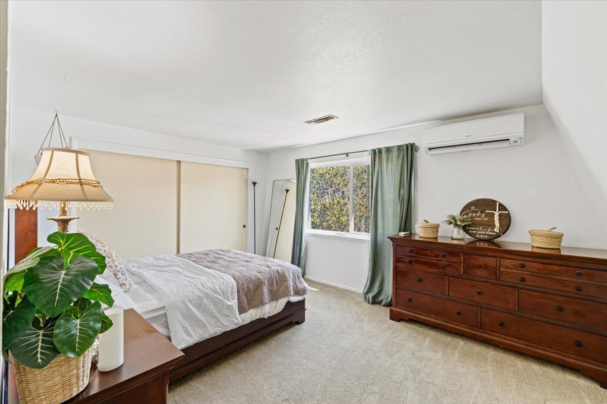 10402 Newtown Road Nevada City, CA 95959 - Photo 17 of 44 a bedroom with a bed and a window