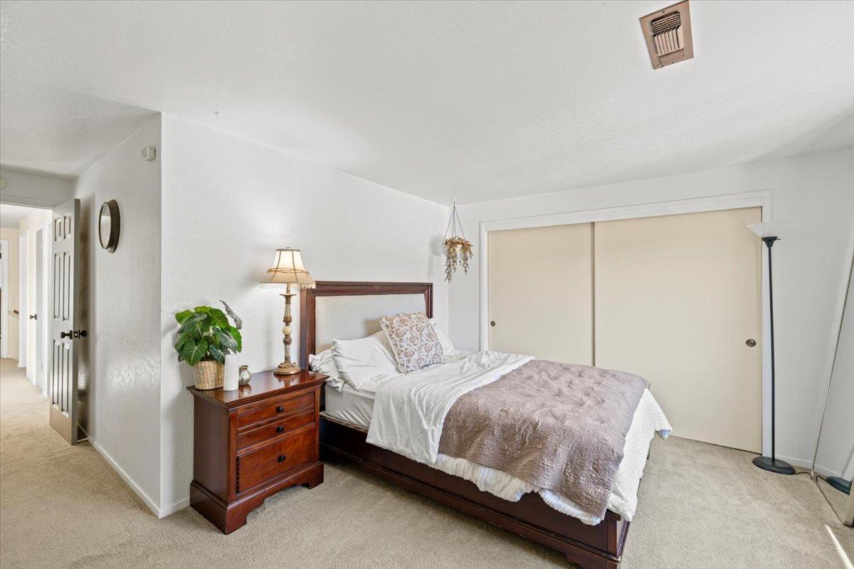 10402 Newtown Road Nevada City, CA 95959 - Photo 18 of 44 a bedroom with a bed and window