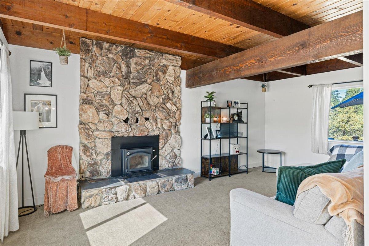 10402 Newtown Road Nevada City, CA 95959 - Photo 8 of 44 a living room with furniture and a fireplace