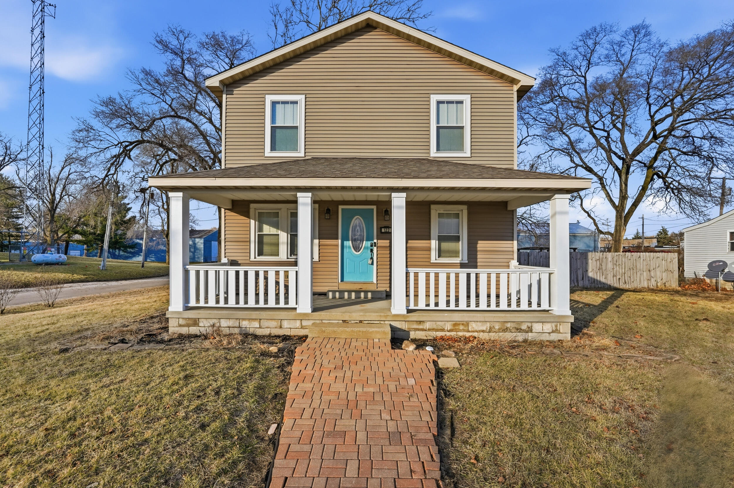 a front view of a house with a yard
