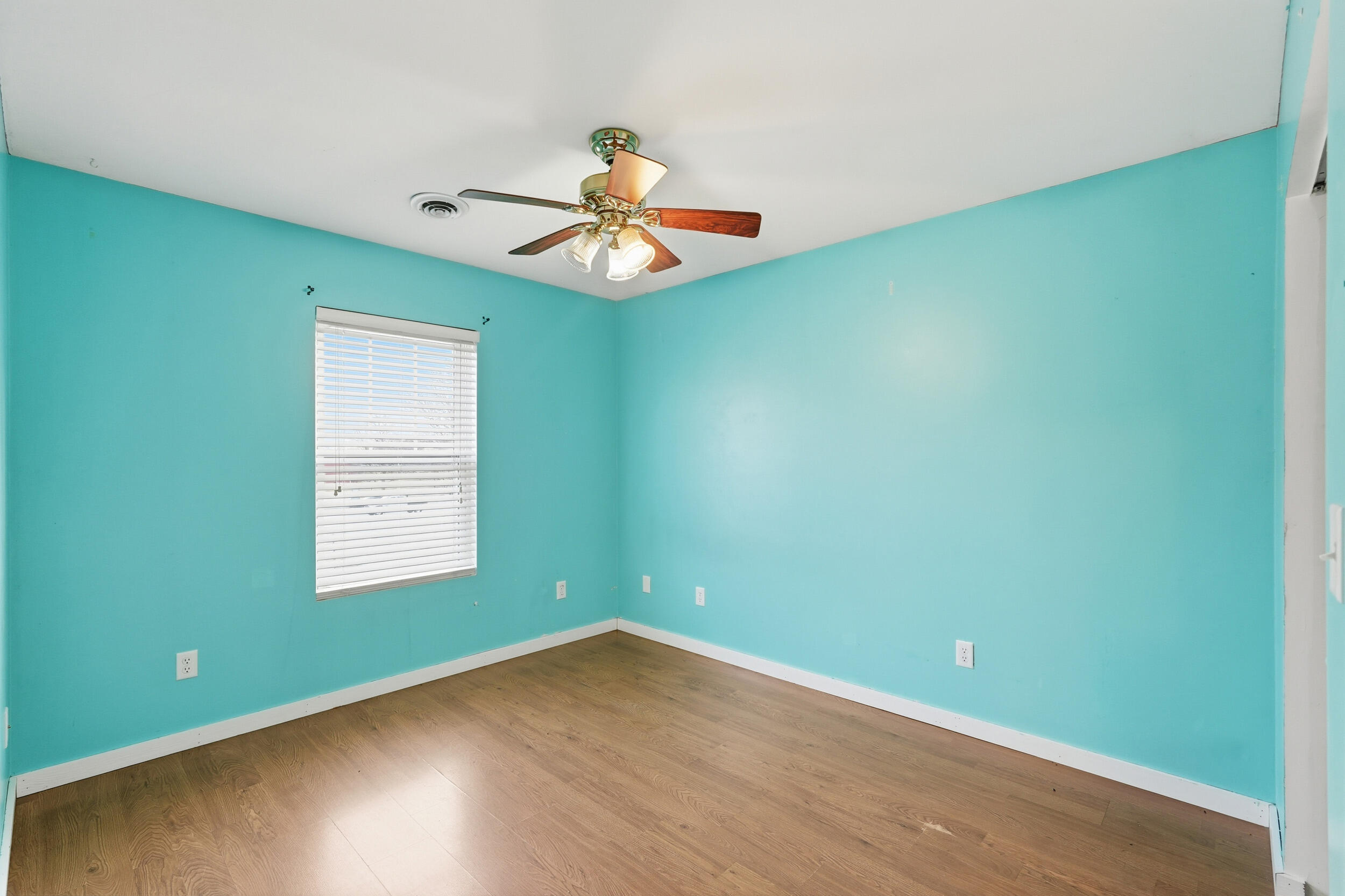 122 9th Street Southwest De Motte, IN 46310 - Photo 16 of 29 an empty room with wooden floor and windows