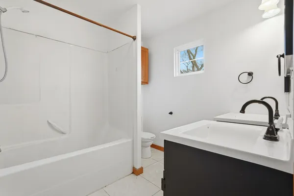 a bathroom with a sink and a bathtub