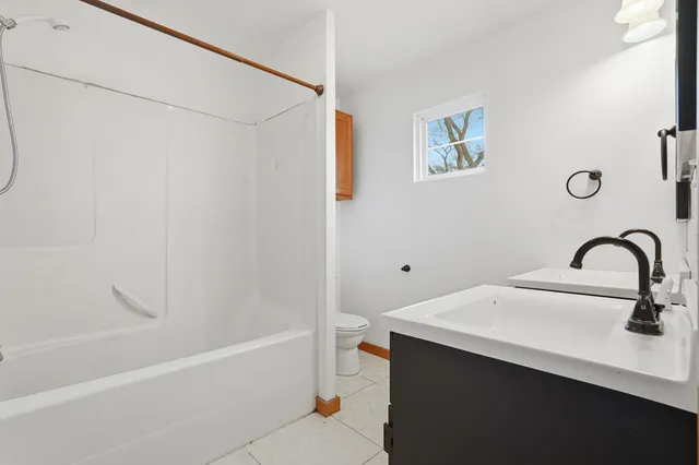 a bathroom with a sink and a bathtub