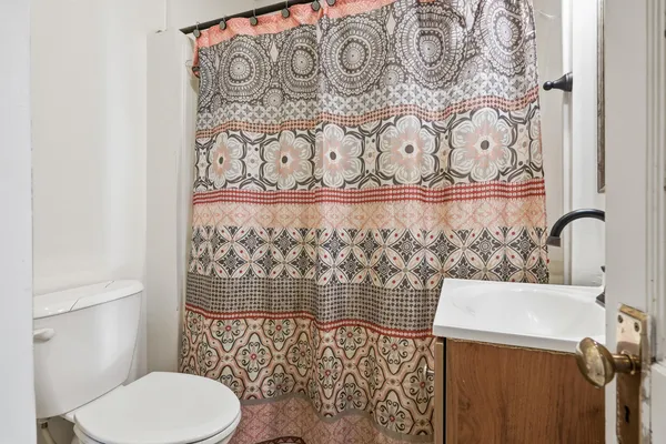 a bathroom with a toilet and sink