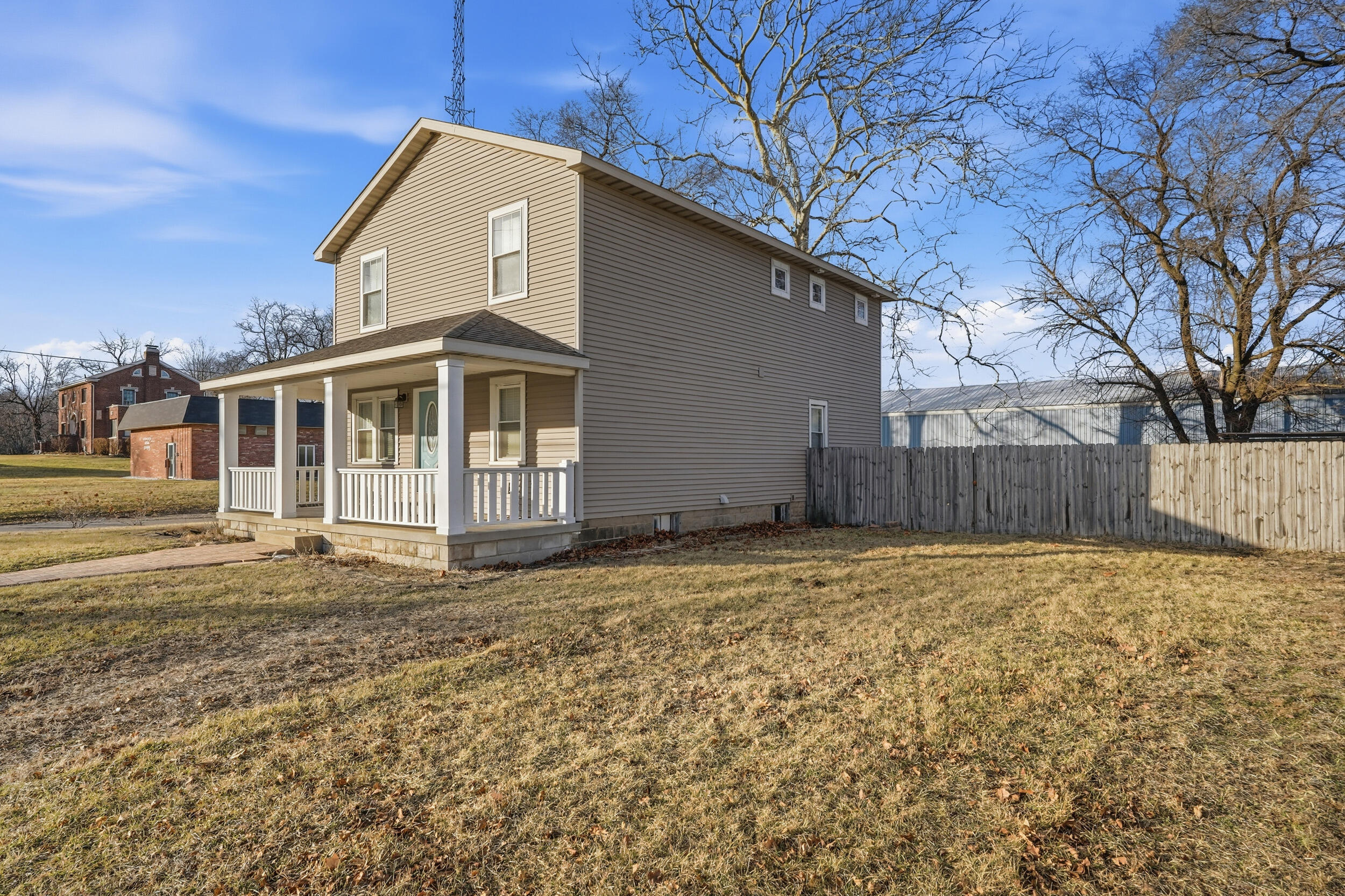 122 9th Street Southwest De Motte, IN 46310 - Photo 4 of 29 a house with trees in front of it