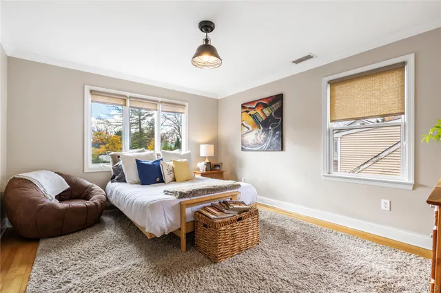 a bedroom with a bed furniture and a window