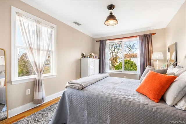 a bedroom with a bed and window