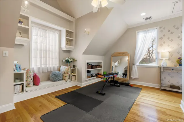 a living room with furniture a rug and a large window