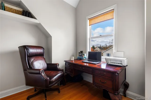 a work room with furniture and a window