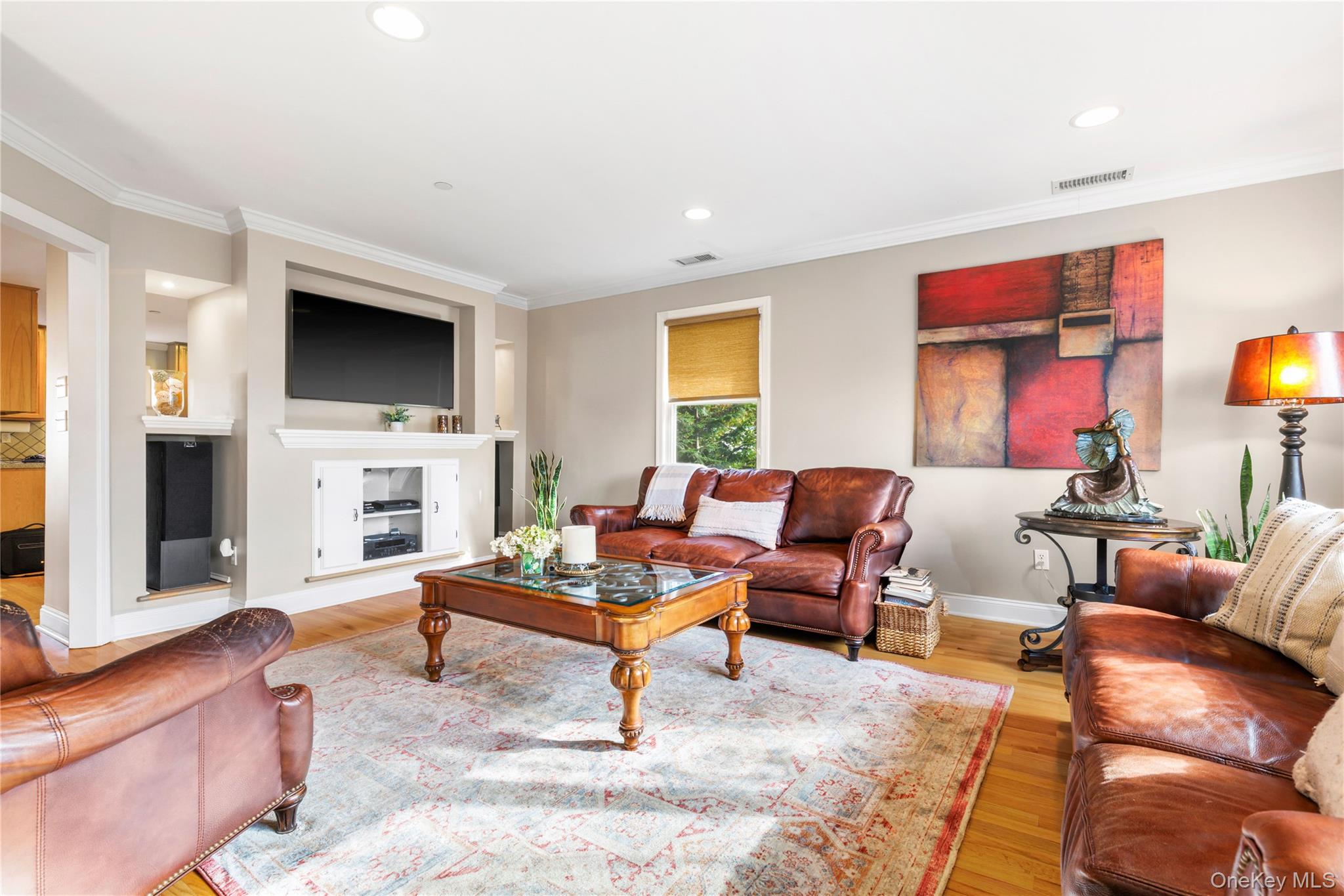 2 Goldwin Street, Unit 2 Rye, NY 10580 - Photo 4 of 28 a living room with furniture a fireplace and a flat screen tv