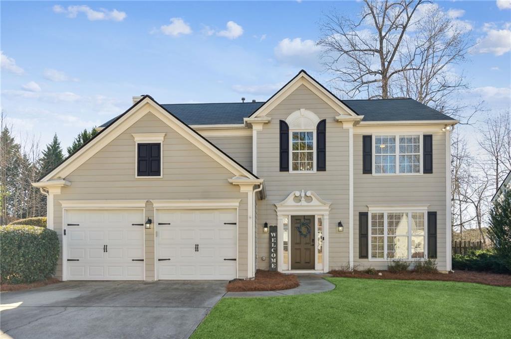 5260 West Price Road Suwanee, GA 30024 - Photo 1 of 1 a view of a house with a yard