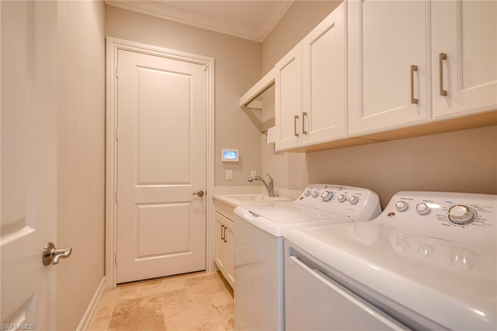 6560 Roma Way Naples, FL 34113 - Photo 17 of 24 a utility room with dryer and washer