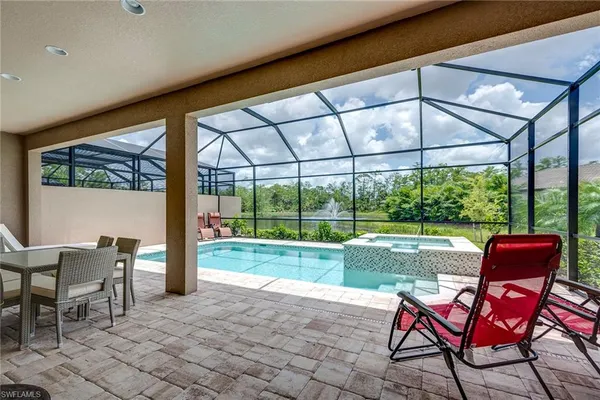 a house view with a sitting space and garden