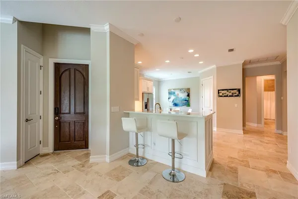 a view of a hallway with dining area