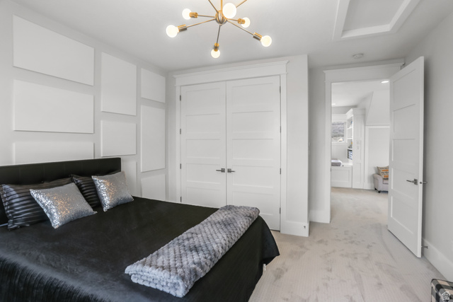 1354 South 800 East Mapleton, UT 84664 - Photo 54 of 129 Bedroom with suspended lighting, light colored carpet, and a closet