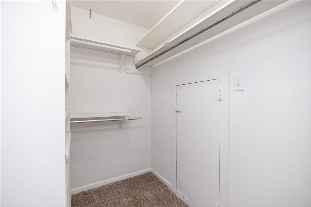 320 Long Point Drive Portland, TX 78374 - Photo 18 of 40 Walk-in closet featuring carpeted flooring, multip