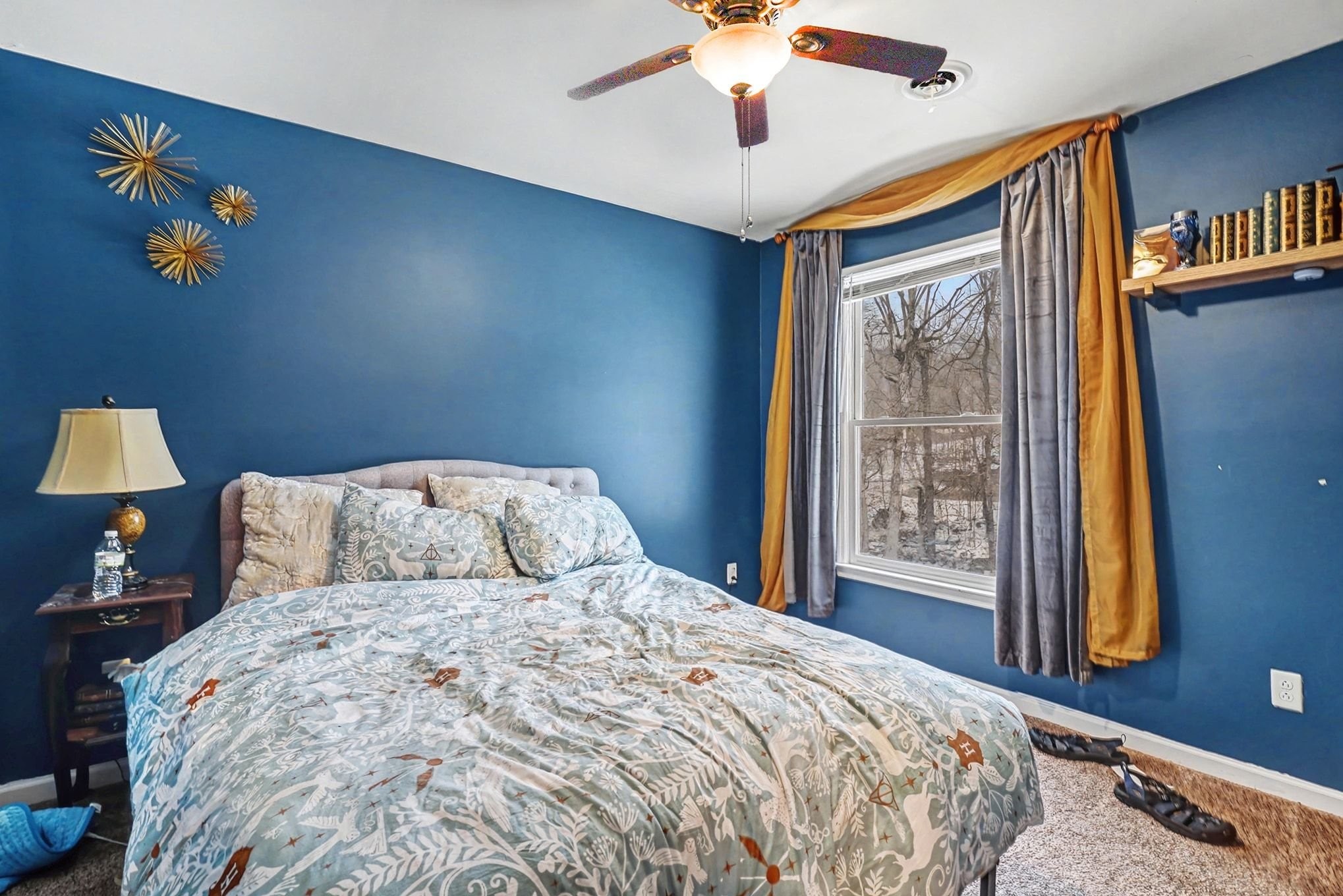 2202 Woodmont Drive Springfield, TN 37172 - Photo 30 of 43 a bedroom with a large bed and a chandelier