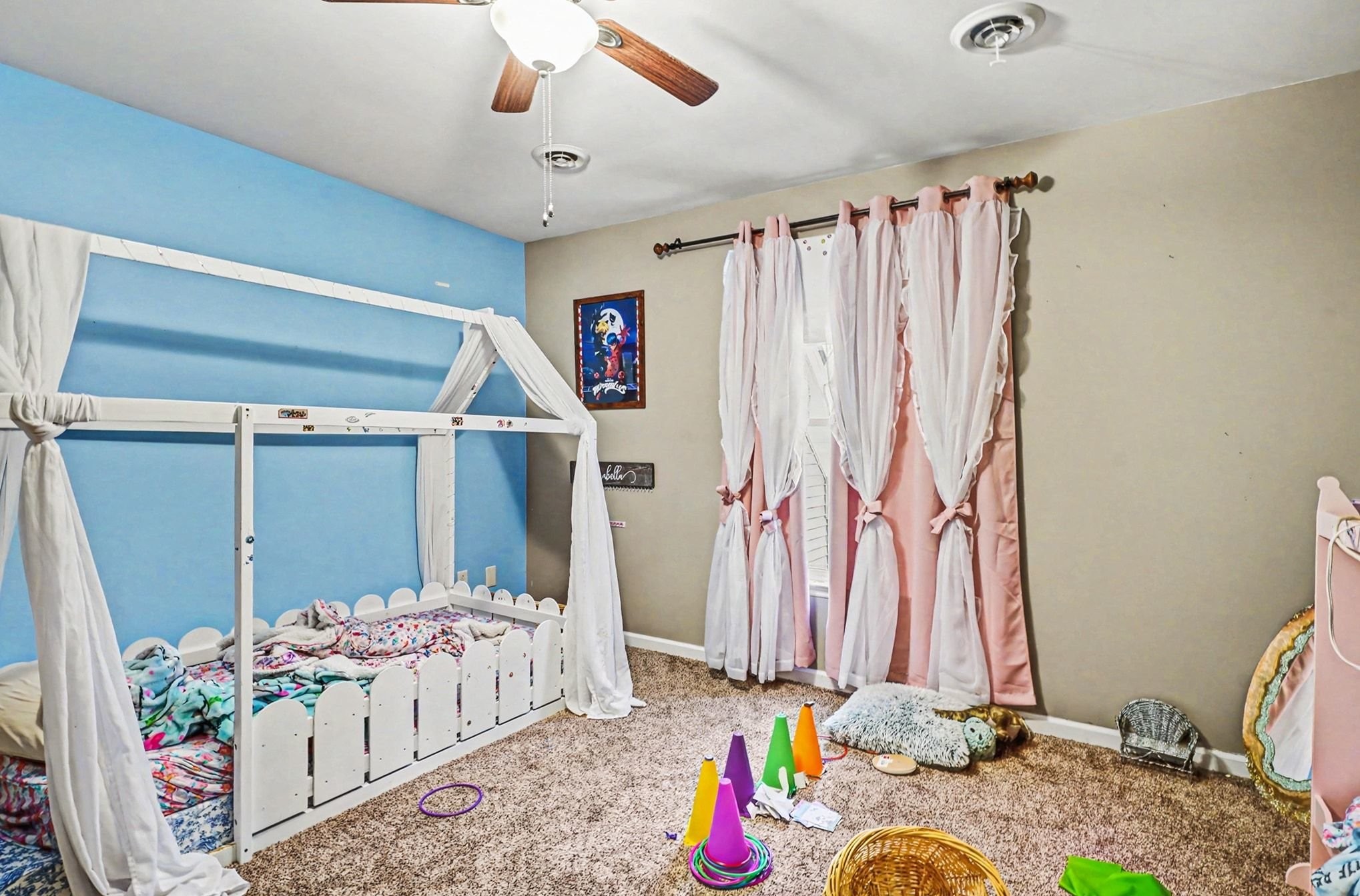 2202 Woodmont Drive Springfield, TN 37172 - Photo 31 of 43 a bedroom with a bed and a chandelier