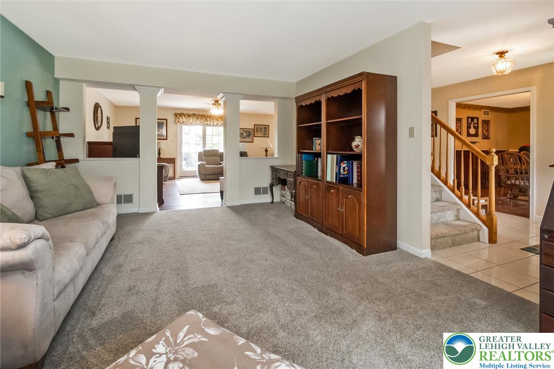 1795 Freier Road Quakertown, PA 18951 - Photo 17 of 69 A naturally illuminated living room connects to other areas, offering an adaptable layout for various needs.