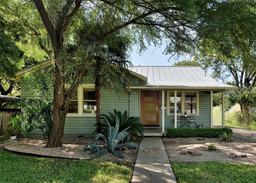 1213 Ruth Avenue, Unit 1 Austin, TX 78757 - Photo 1 of 1 a front view of a house with a garden
