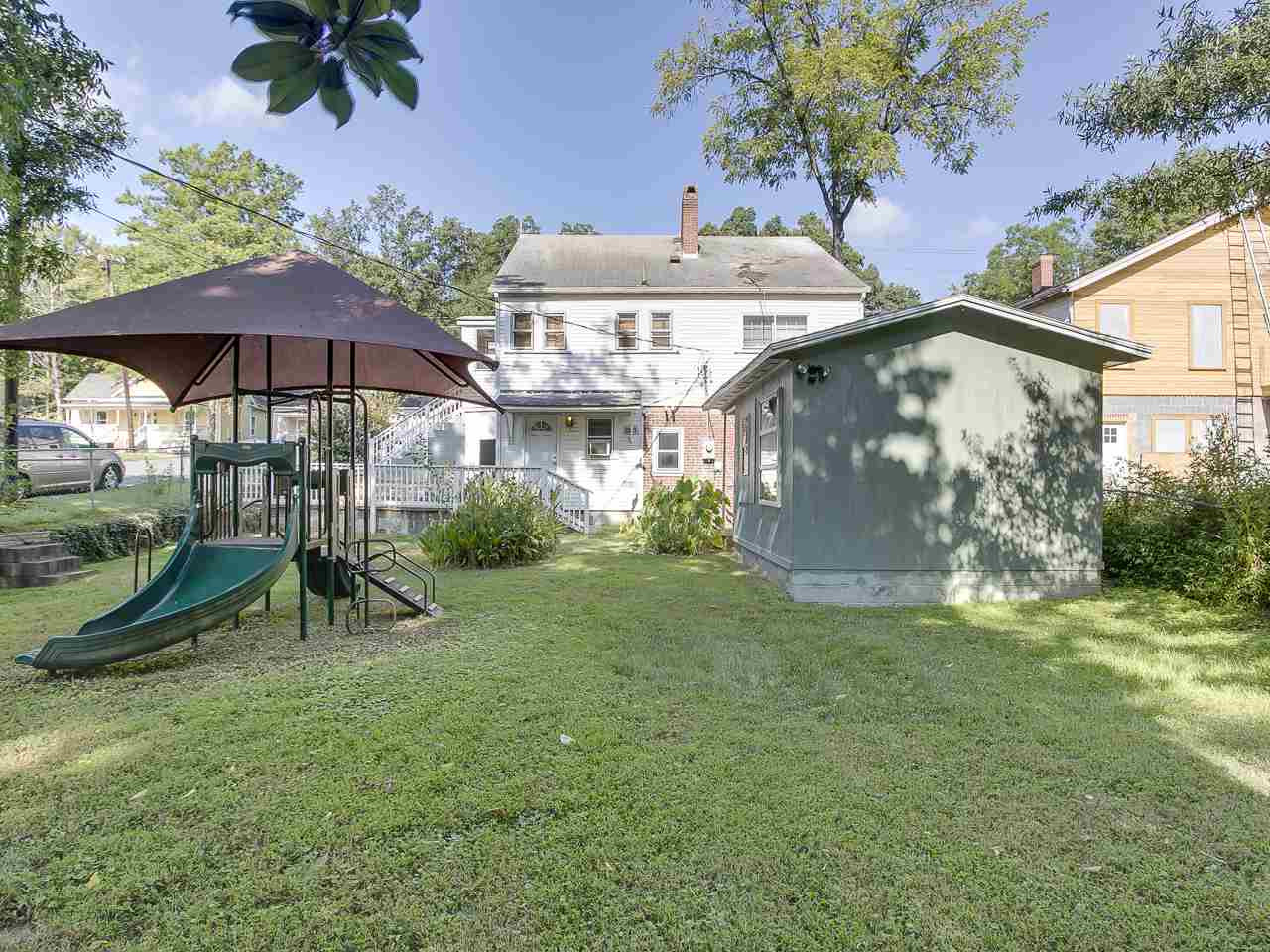 1216 North Roxboro Street Durham, NC 27701 - Photo 22 of 25 Large, fened-in yard with play structure and mature trees