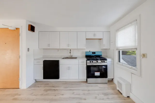 a kitchen with a stove and a refrigerator