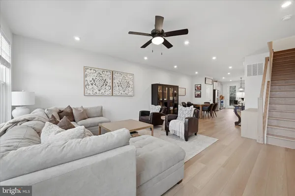 a bedroom with furniture and a flat screen tv