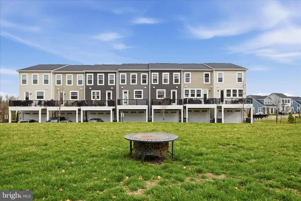 an aerial view of residential house and sandy dunes