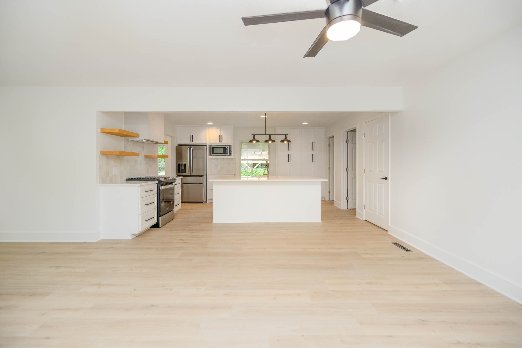 1401 Manor Road Columbia, TN 38401 - Photo 9 of 35 a view of a kitchen with wooden cabinet and a refrigerator