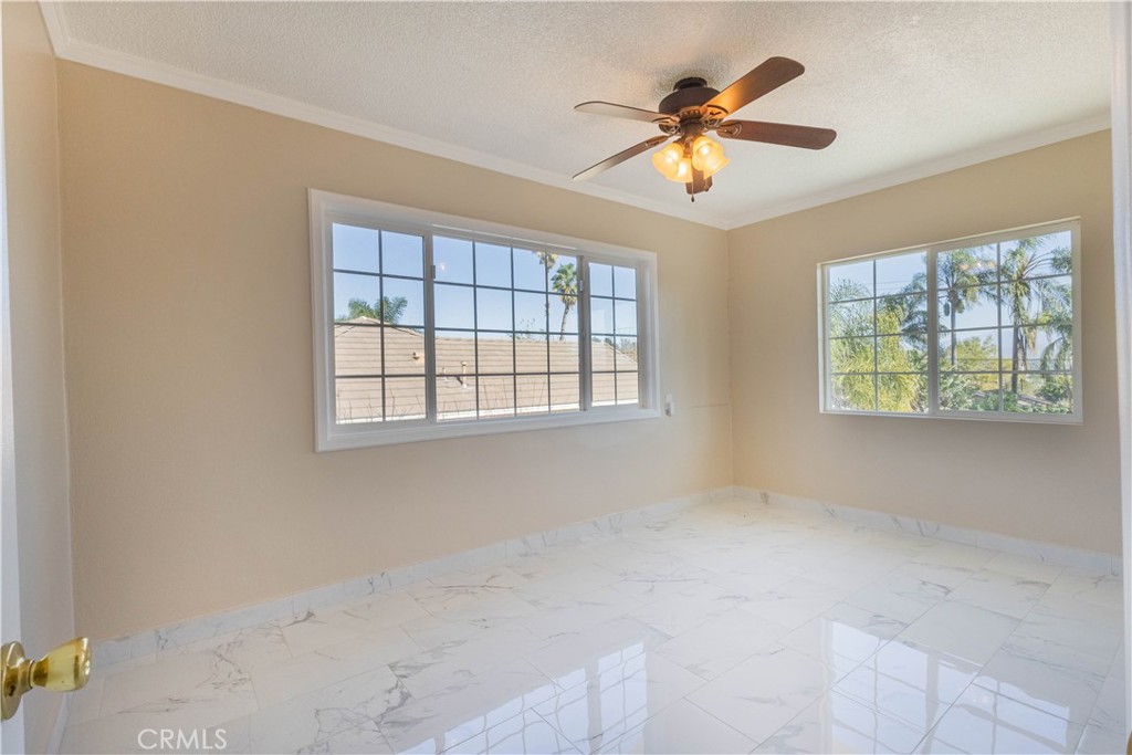 11711 Carmine Street Riverside, CA 92505 - Photo 20 of 33 a view of an empty room with a window