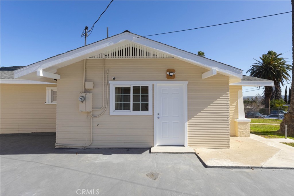 11711 Carmine Street Riverside, CA 92505 - Photo 23 of 33 a front view of a house with a garage