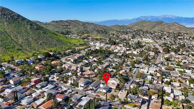 an aerial view of a house with a yard