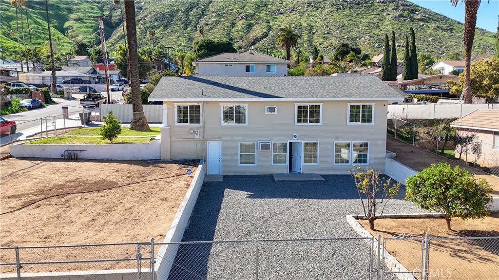 11711 Carmine Street Riverside, CA 92505 - Photo 7 of 33 a front view of a house with garden