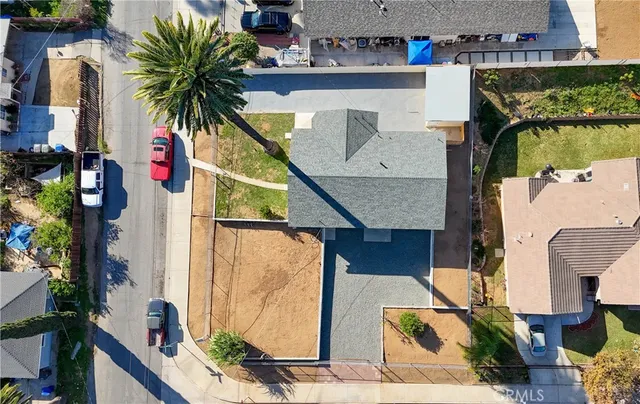 an aerial view of a house with outdoor space