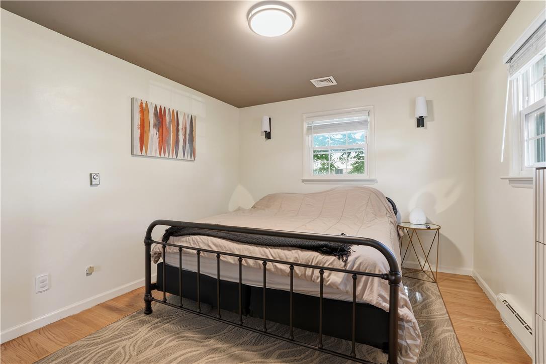 2918 Keystone Street Bethlehem, PA 18020 - Photo 15 of 54 Warm wood flooring creates a cozy and inviting atmosphere in this sun-filled bedroom.
